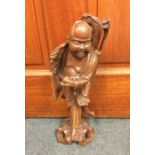 An Oriental root wood figure of a man. Approx. 38