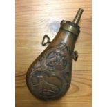 A brass mounted and copper shot flask. Est. £20 -