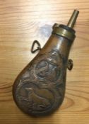 A brass mounted and copper shot flask. Est. £20 -