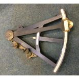 An old brass mounted navigational instrument. By S