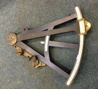 An old brass mounted navigational instrument. By S
