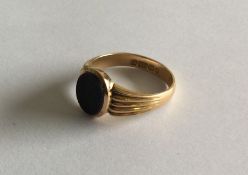 A large 15 carat gent's signet ring with reeded de