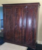 A Victorian mahogany three door wardrobe. Est. £