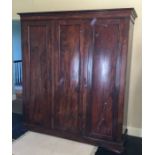 A Victorian mahogany three door wardrobe. Est. £