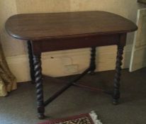 A small oak barley twist table. Est. £30 - £40.