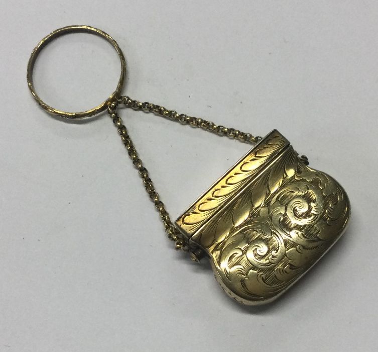 A rare silver gilt vinaigrette in the form of a handbag. Birmingham 1842. By Waddell and Kempson.