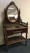 A Continental hardwood dressing table on turned su