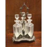 A good silver plated three bottle tantalus. Est. £