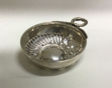 An early 20th Century silver wine taster. Approx. 24 grams. Est. £30 - £50.