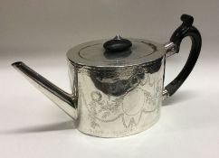 A George III silver teapot with bright cut decoration to body. London 1777.Approx. 366 grams.