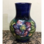 MOORCROFT: A clematis vase. Approx. 26cms in heigh