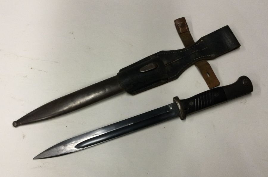 An old bayonet. Est. £10 - £20.