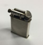 A solid Dunhill style lighter. Est. £80 - £120.