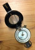 A heavy brass Military compass. Est. £20 - £30.