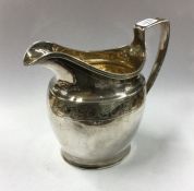 A good Georgian silver cream jug with gadroon rim.