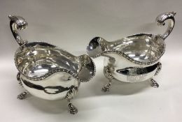 A fine quality pair of George III oval silver sauceboats. London 1767. By George Smith. Approx.