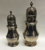 A rare pair of baluster shaped Queen Anne silver c