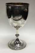 A fine Victorian silver engraved goblet decorated with flowers. London 1870. By John Harris. Approx.