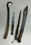 Three ethnic knives together with one other. Est.