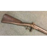 An old flintlock double barrel gun. Est. £40 - £60