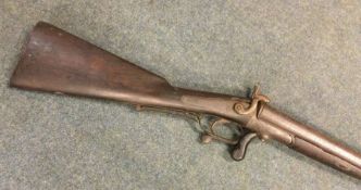 An old flintlock double barrel gun. Est. £40 - £60