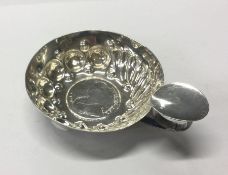 A 19th Century French silver wine taster with central coin. Approx. 60 grams. Est. £80 - £120.