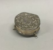 A silver chased jewellery box on feet. Birmingham. Approx. 44 grams. Est. £20 - £30.