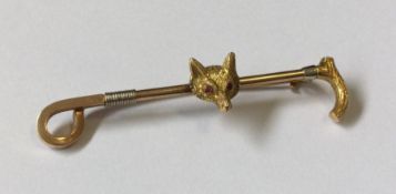 A heavy 14 carat three colour gold hunting brooch.