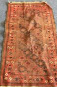 An old rug. Est. £20 - £30.