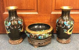 A pair of cloisonné vases together with matching b