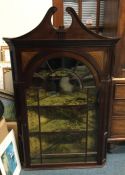 a Victorian mahogany inlaid corner cupboard. Est.