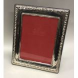 A large and stylish rectangular Continental silver frame. Est. £100 - £120.