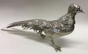 A heavy silver figure of a bird. Marked to wing. Approx. 386 grams. Est. £600 - £800.