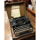An old typewriter. Est. £10 - £20.