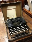 An old typewriter. Est. £10 - £20.