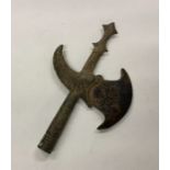 An Eastern axe head with carved stone blade. Est.