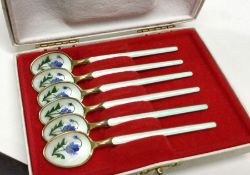 A set of six cased Norwegian silver and enamel spoons. Approx. 60 grams. Est. £120 - £150.