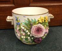 An attractive circular two handled jardinière prof