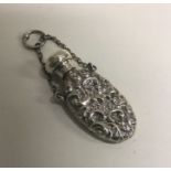 A Victorian silver chased scent bottle with suspension chain. Birmingham 1888. Approx. 11 grams.