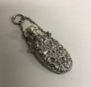 A Victorian silver chased scent bottle with suspension chain. Birmingham 1888. Approx. 11 grams.