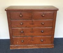 A stripped pine chest of five drawers. Est. £50 - £