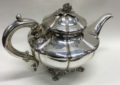 A fine quality panelled William IV silver teapot with chased flower finial. London 1838. Approx. 676