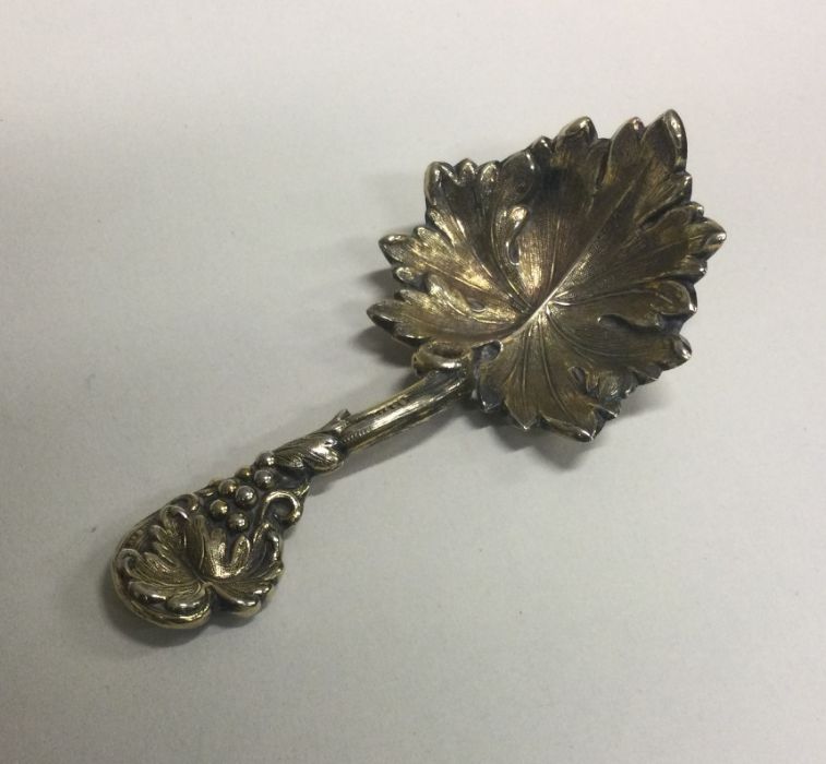 A finely chased Victorian silver caddy spoon with vine decoration. London 1839. By Elizabeth