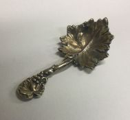 A finely chased Victorian silver caddy spoon with vine decoration. London 1839. By Elizabeth