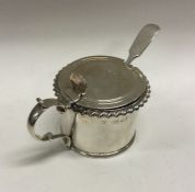 A George III crested silver mustard pot. London 1829. By William Hewitt. Approx. 138 grams. Est. £