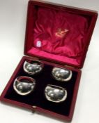 A set of four cased silver napkin rings. Numbered 14. Sheffield 1922. By Thomas Bradbury and Sons.
