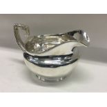 A George III silver cream jug. London 1805. By Robert Sallam. Approx. 226 grams. Est. £140 - £180.