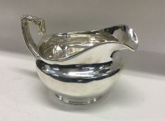 A George III silver cream jug. London 1805. By Robert Sallam. Approx. 226 grams. Est. £140 - £180.