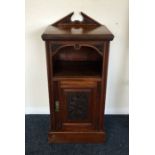 An Edwardian mahogany bedside cabinet. £20 - £30.