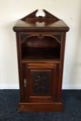 An Edwardian mahogany bedside cabinet. £20 - £30.